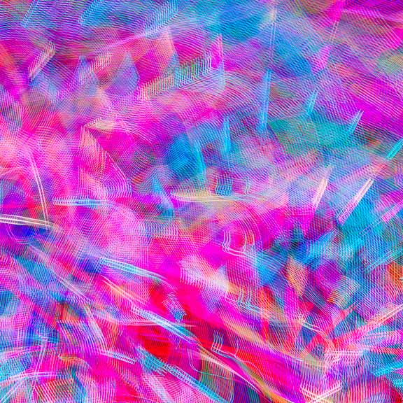 Long-exposure abstract photo of the light display on the Pacific Wheel, Santa Monica Pier.